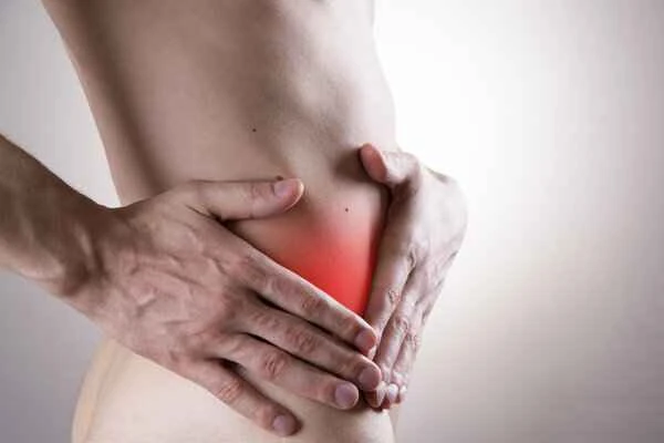 What are the symptoms of scrotal tumors?