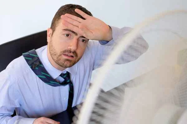 What causes scrotal hot flashes?